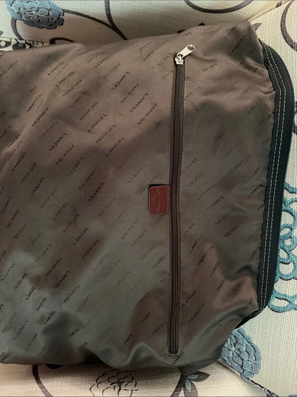 Black Duffel Bag with Tan Handles and Brown Accents